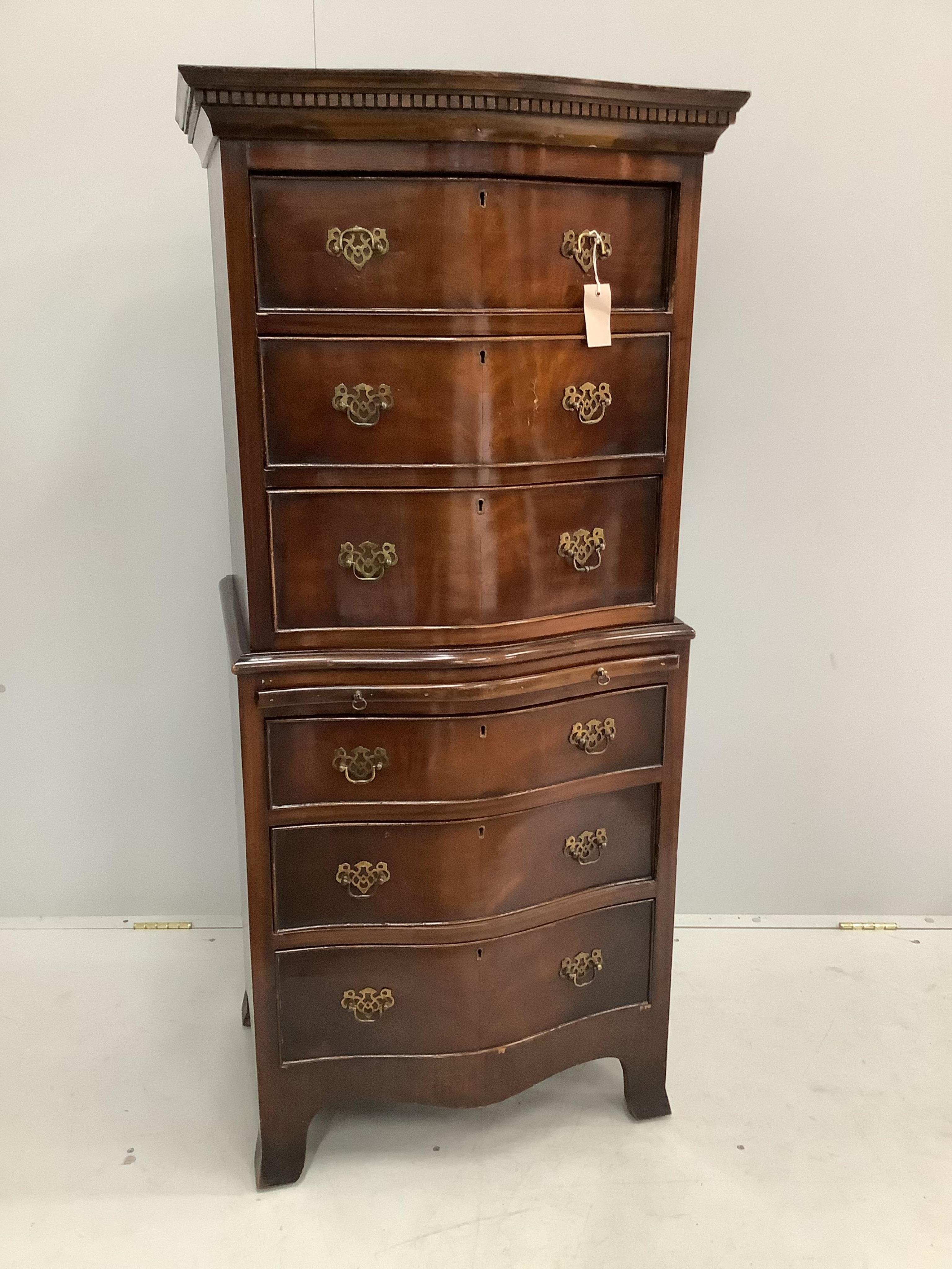 A George III style mahogany narrow serpentine chest on chest with slide, width 63cm, depth 48cm, height 139cm. Condition - fair